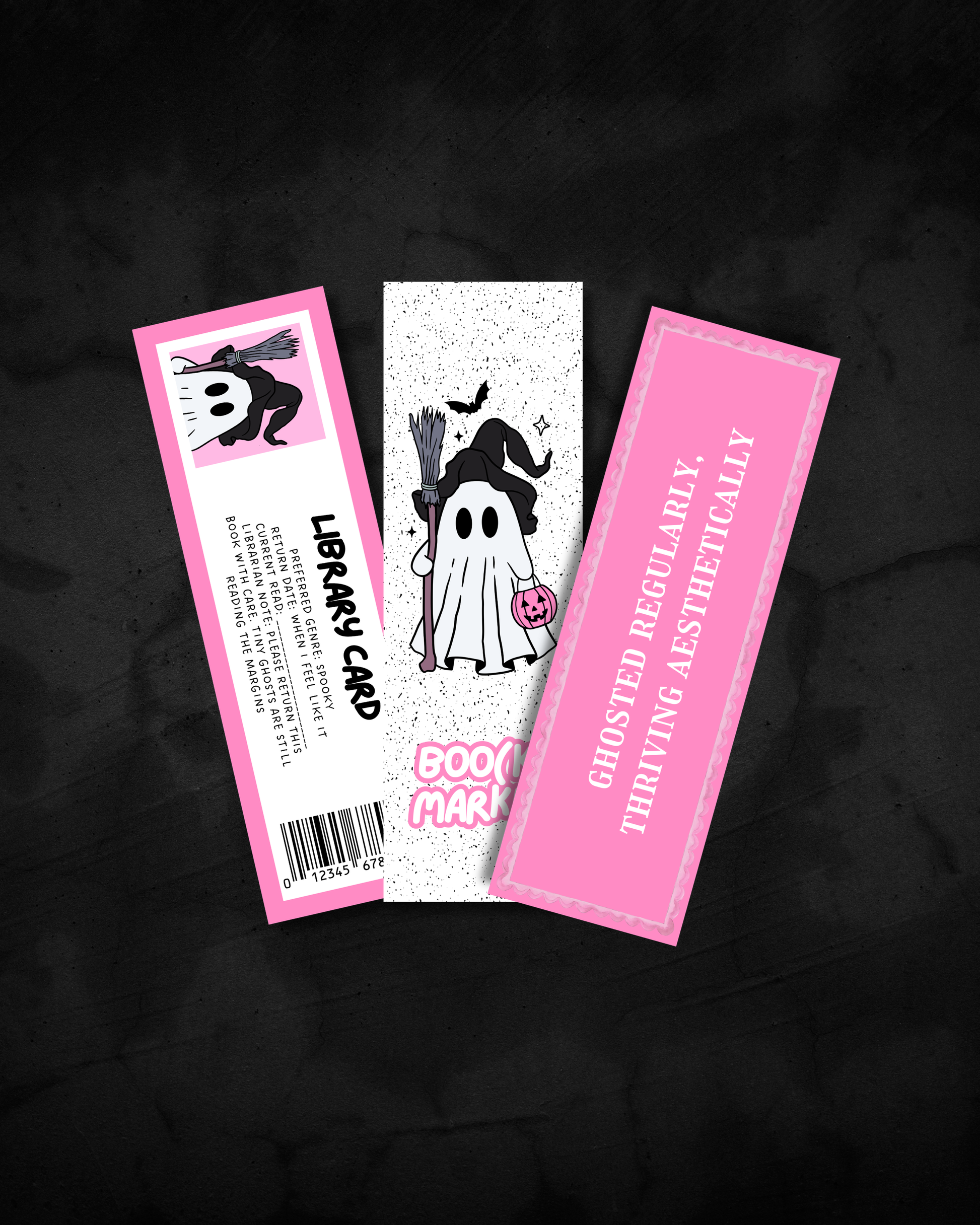 Three Halloween-themed library cards displayed on a dark textured background. The left card is pink with a cartoon witch and the text 'LIBRARY CARD'.