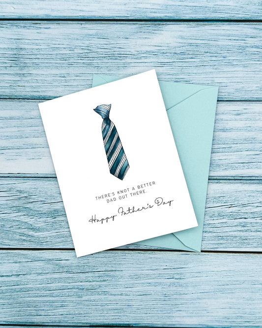 Father's Day card with a tie illustration and envelope on a wooden surface