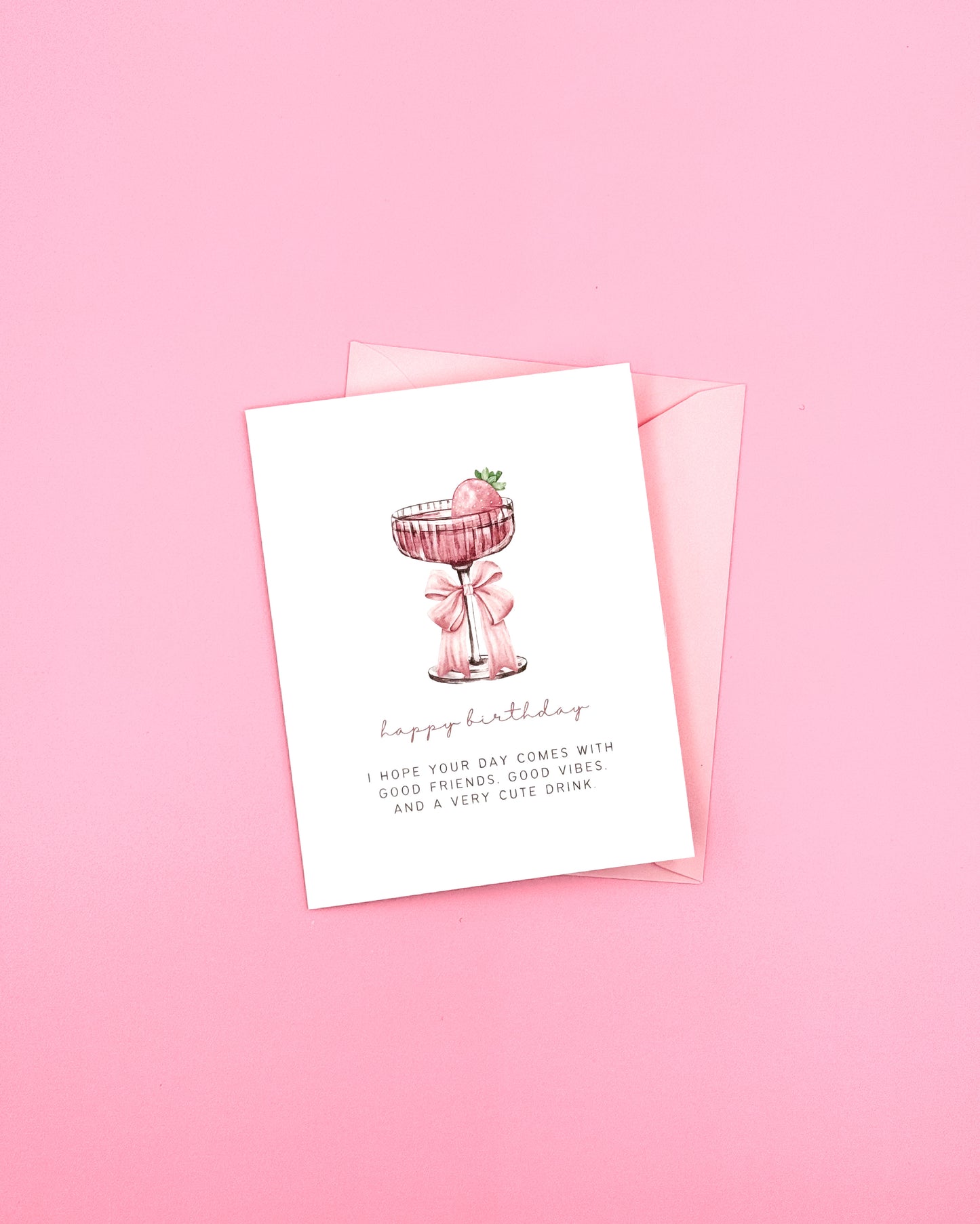 Greeting card with a pink drink illustration on a pink background