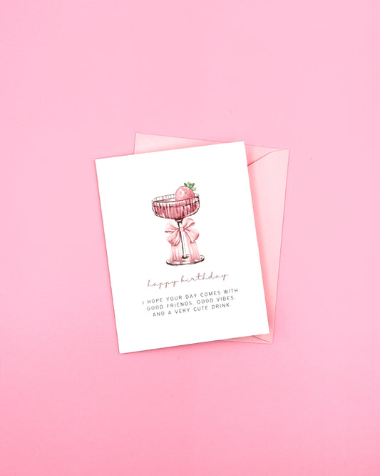 Greeting card with a pink drink illustration on a pink background