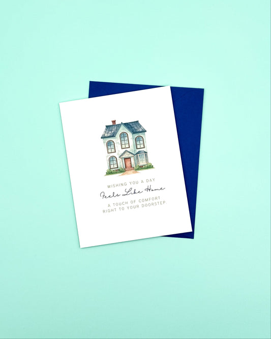 Greeting card with house illustration on a blue background