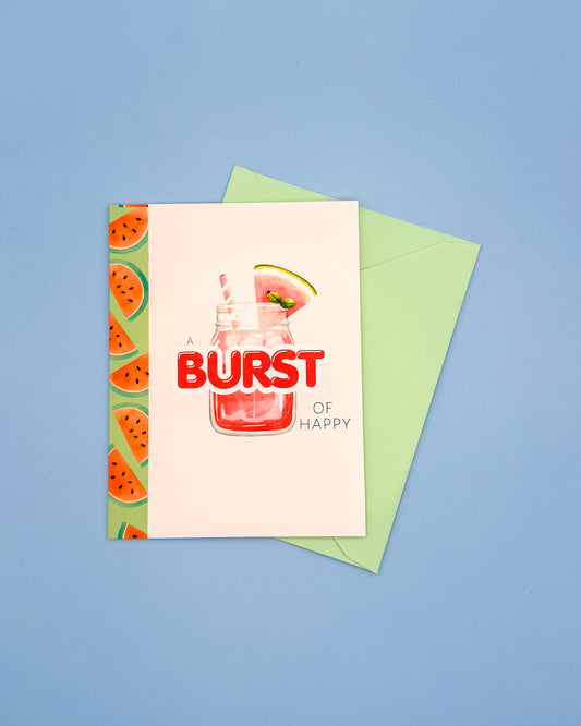 Greeting card with watermelon design and 'Burst of Happy' text on a blue background