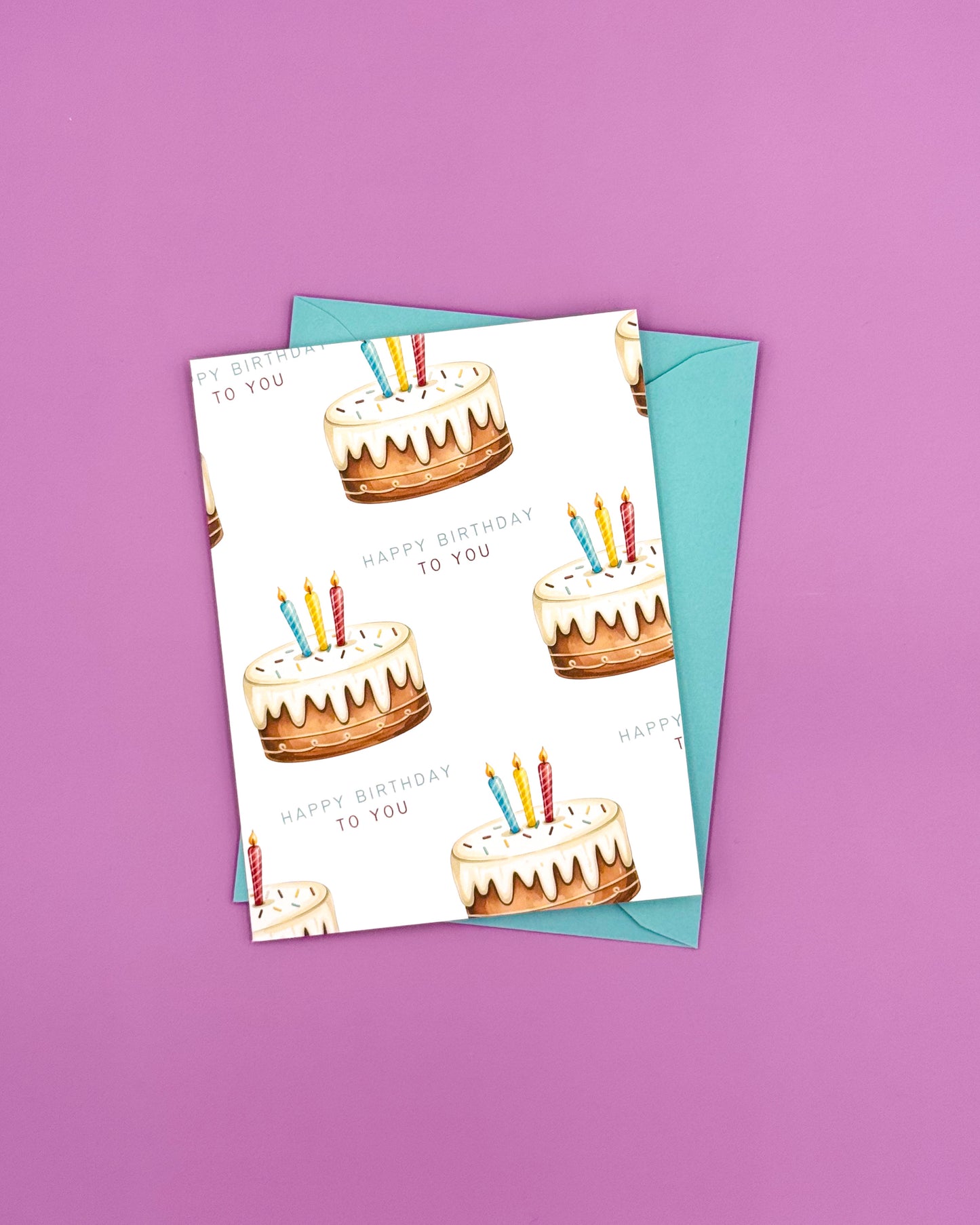 Birthday card with cake illustrations and candles on a purple background