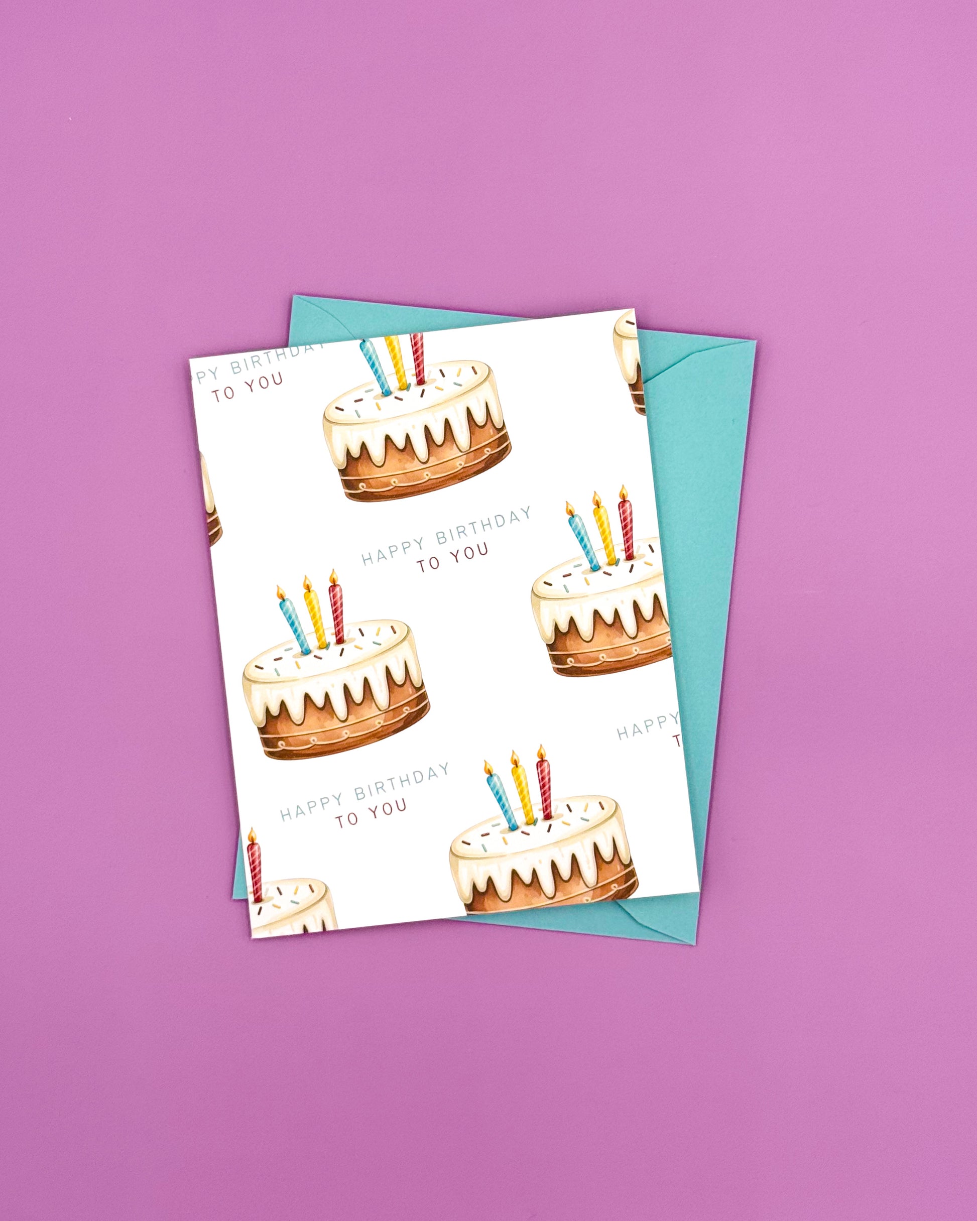 Birthday card with cake illustrations and candles on a purple background