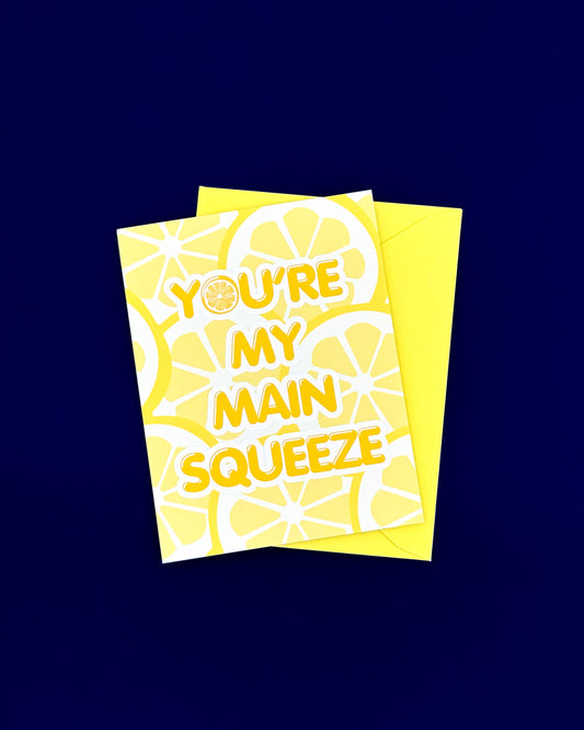 Two yellow greeting cards with lemon designs and text on a dark blue background