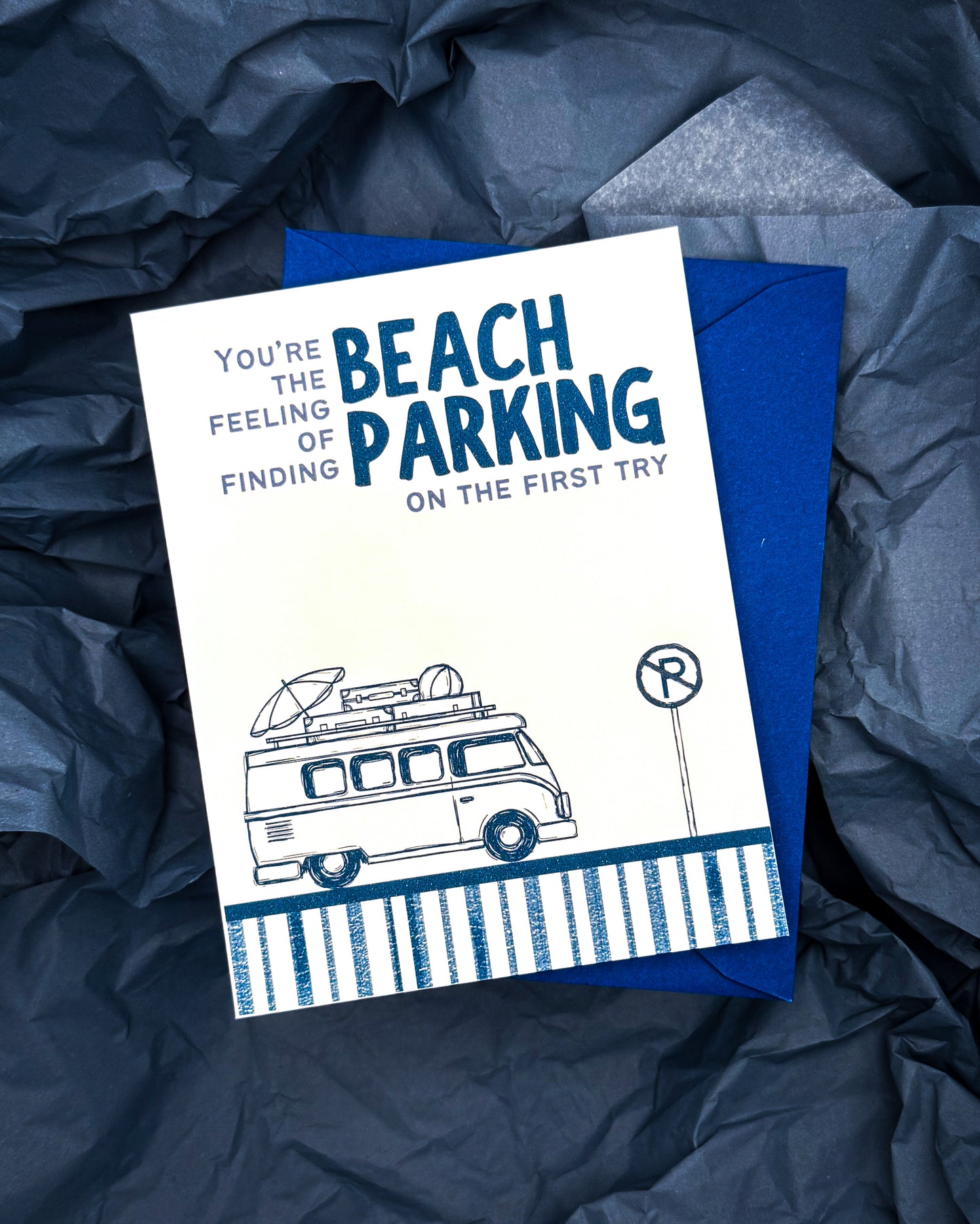 Card with text and illustration of a van on a blue textured background