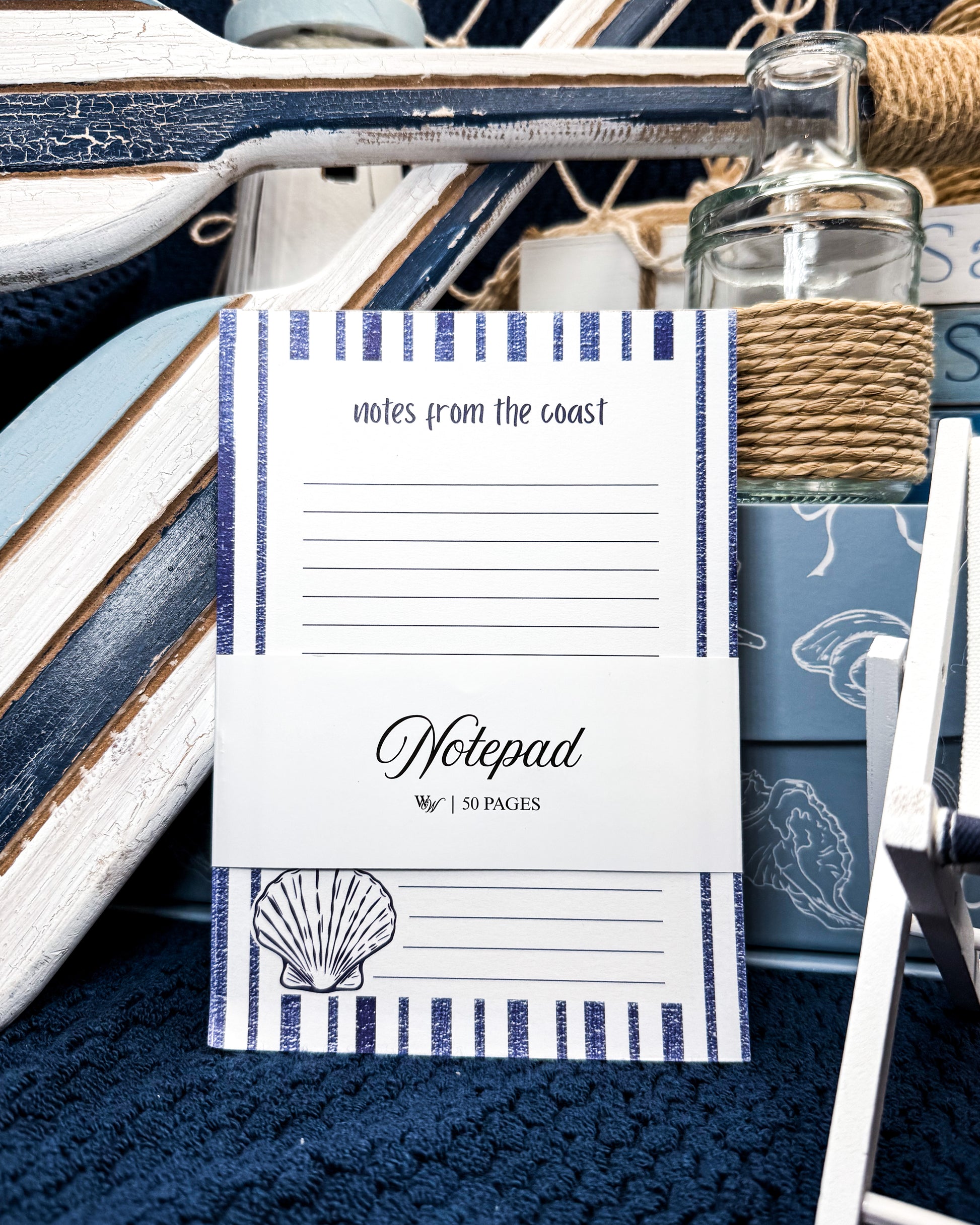 Notepad with 'notes from the coast' design on a nautical-themed background